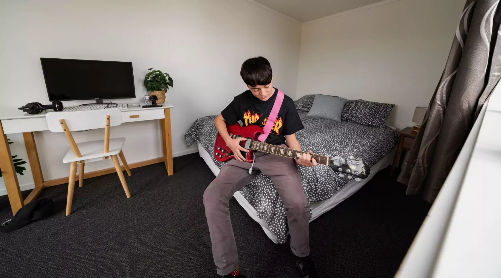 Cabin - playing guitar on bed